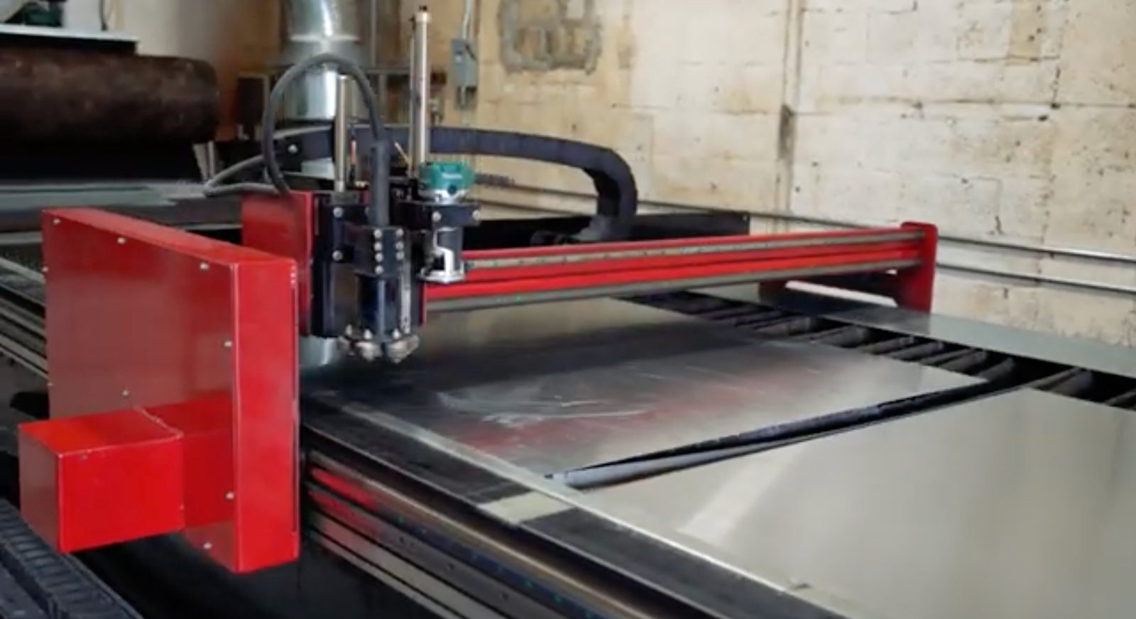 In-house CNC plasma table cutting sheet metal at the fabrication shop